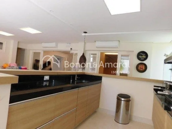 Imagem Casa em condomínio com 410 m² e 4 quartos