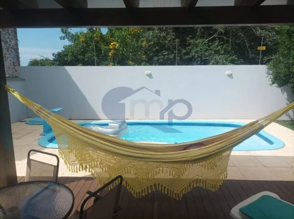 Imagem Casa de alto padrão á venda com 4 suites no bairro Centenário em Torres/RS