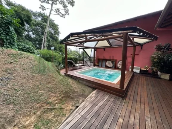 Imagem Deslumbre-se com esta incrível oportunidade de adquirir uma casa dos sonhos no exclusivo condomínio Yacamim, localizado em Ilhabela. Com uma vista esp