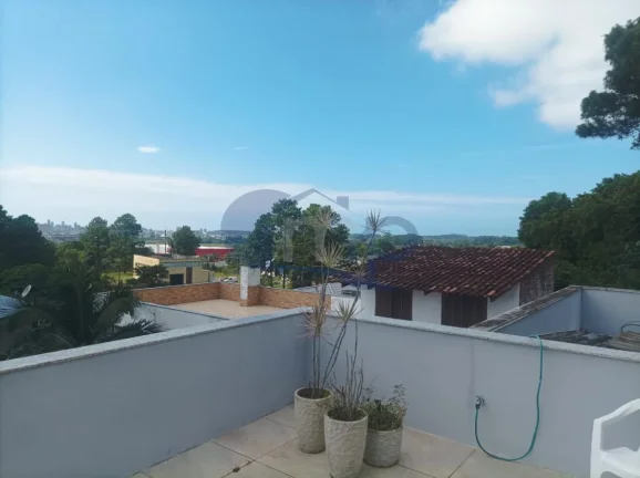 Imagem Casa de alto padrão á venda com 4 suites no bairro Centenário em Torres/RS