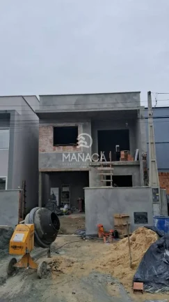 Imagem Dois Sobrados (meio de quadra) 3 dormitórios sendo 1 suíte com sacada localizado em Barra Velha - SC