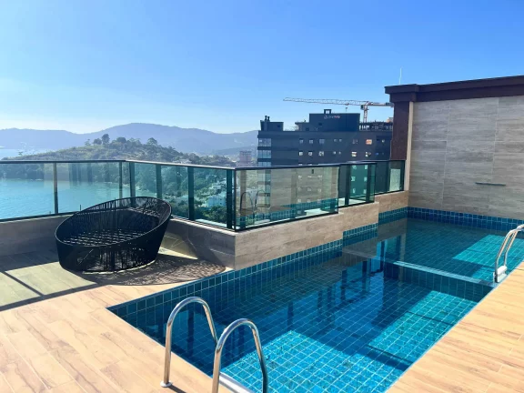Imagem Apartamento vista mar com 3 suítes e 2 vagas de garagem em Balneário Perequê - SC