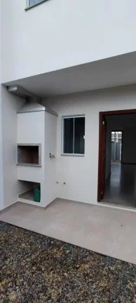 Imagem Casa com 2 Dormitórios sendo 1 suíte e 1 vaga na Garagem em Navegantes.