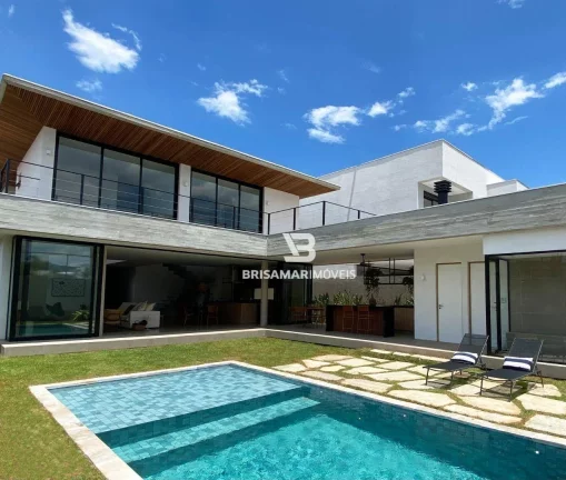 Imagem CASA DE ALTO PADRÃO EM CONDOMÍNIO PRIVILEGIADO NO GUARUJÁ – 5 SUÍTES, ÁREA GOURMET E BEACH HOUSE