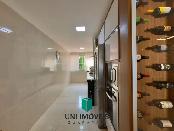 Imagem Triplex à venda em bairro nobre de Guarapari com área gourmet e deck para lagoa