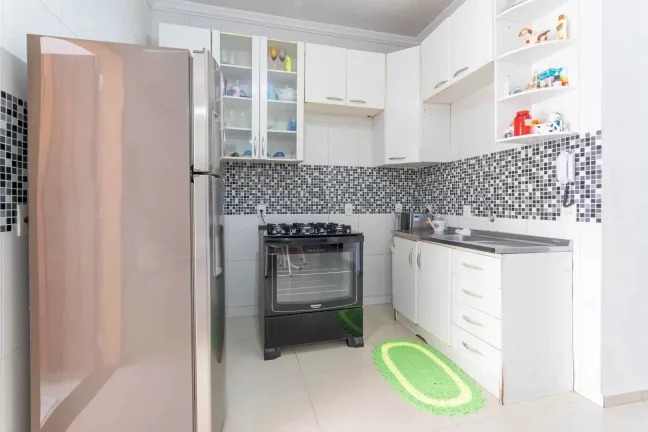 Imagem Casa com 3 suítes e 2 vagas de garagem no Centro de Balneário Camboriú.