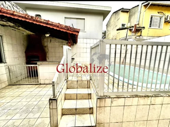 Imagem Casa à venda com 275m², 4 quartos, 4 vagas, piscina, churrasqueira por R$ 609.000,00 no Bom Retiro - Santos