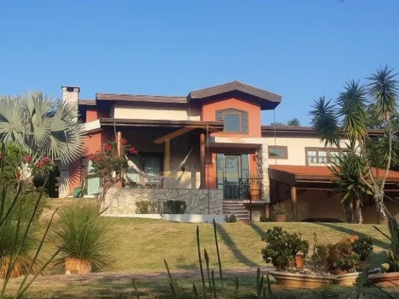 Imagem Casa em condomínio fechado, Imóvel térreo com desnível entre a área social e a área íntima, e...