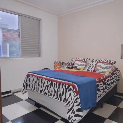 Imagem Apartamento com 2 dormitórios à venda, 63 m² por R$ 361.600 - Centro - São Vicente/SP