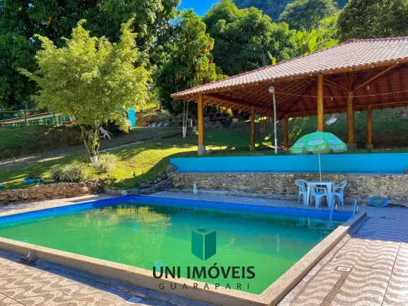 Imagem Chácara com 10 suítes e Cachoeira a venda, 9.104M² na zona rural de Guarapari.