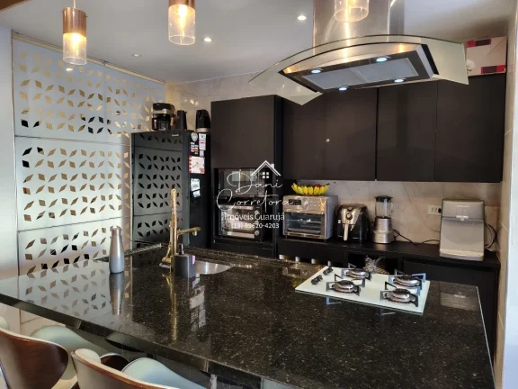 Imagem Imperdível! Apartamento de 2 quartos com suíte e 2 vagas de garagem em Pitangueiras, Guarujá-SP - 78m² de conforto e elegância!