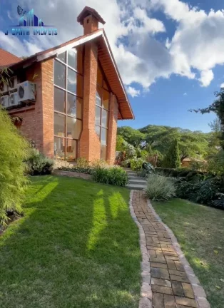 Imagem CASA TÉRREA ESTILO NORMANDO, 4 SUÍTES, TERRENO 1.107m², COND. NA GRANJA