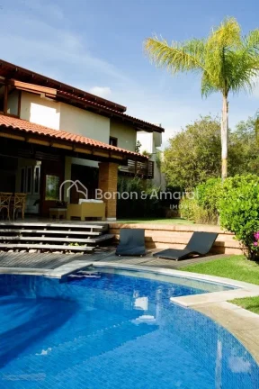 Imagem Casa com arquitetura diferenciada no condomínio Alphaville Campinas. A espaçosa residência possui...