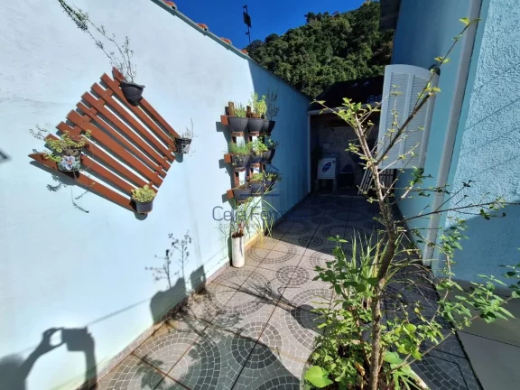 Imagem Excelente sobrado 4 dormitórios com piscina Cocanha - Caraguatatuba/SP