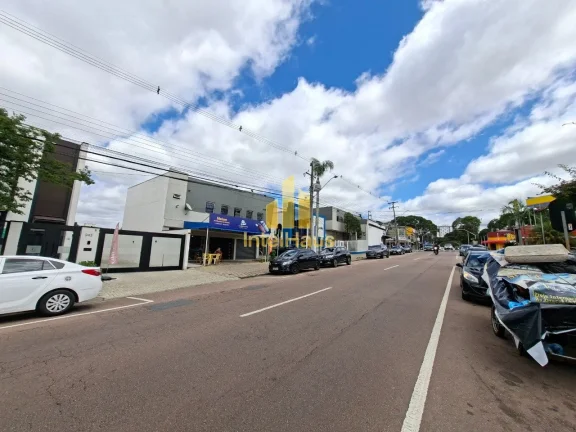 Imagem Imóvel comercial à venda em localização estratégica no Bacacheri, em terreno de esquina com gra...