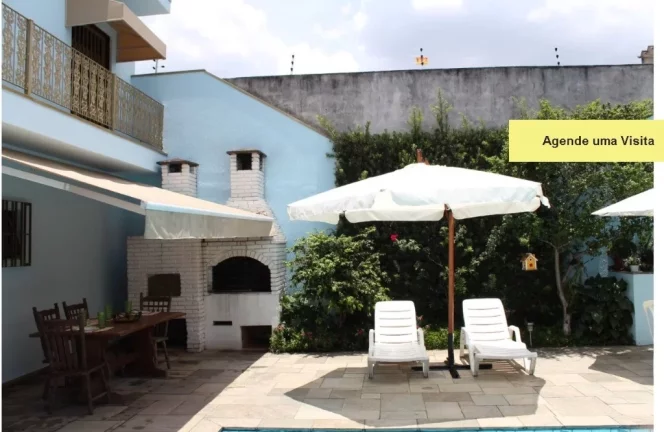 Imagem Casa de Luxo na Vila Ré: 3 Quartos, 3 Suítes, 5 Banheiros, 4 Vagas de Garagem e 426m² de Área em São Paulo-SP.