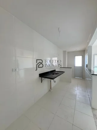 Imagem Apartamento de 2 dormitórios sendo 1 suíte, prédio frente mar no bairro Vila Mirim - Praia Grande