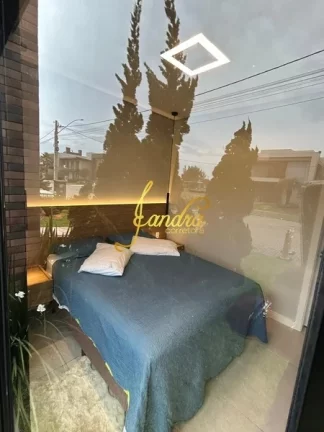 Imagem Excelente sobrado em Condomínio com 04 suítes mobiliada