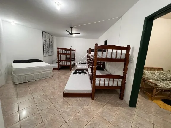 Imagem Casa Jardim Virginia com 4 quartos, 4 suítes, 3 salas e 8 vagas de garagem no Guarujá-SP, bairro Loteamento João Batista Julião!