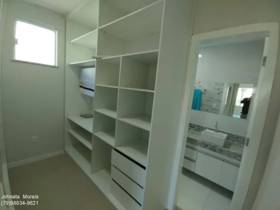 Imagem Casa de Alto Padrão na Aruana: 5 quartos, 4 suítes, posição Leste - Confira!