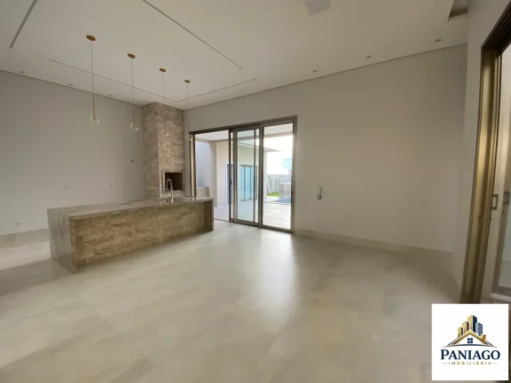 Imagem Casa de alto padrão com 3 suítes, cozinha gourmet e piscina com cascata