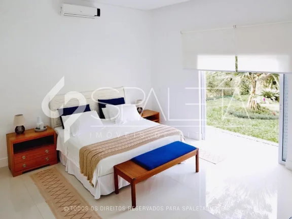 Imagem Oásis de Luxo: Casa térrea com piscina, sauna e píer privativo à venda no condomínio Marina Guarujá