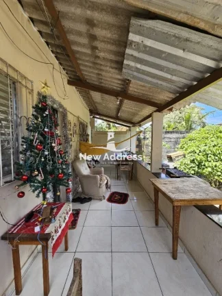 Imagem Casa 2 quartos à venda em Enseada de Jacaraípe, murada e gradeada, ideal para quem busca praticidade e quintal.