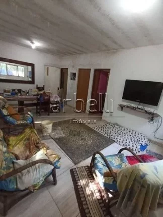 Imagem Sitio com duas casas, a primeira casa de tijolinho tem janelas de alumínio, churrasqueira, varanda ...