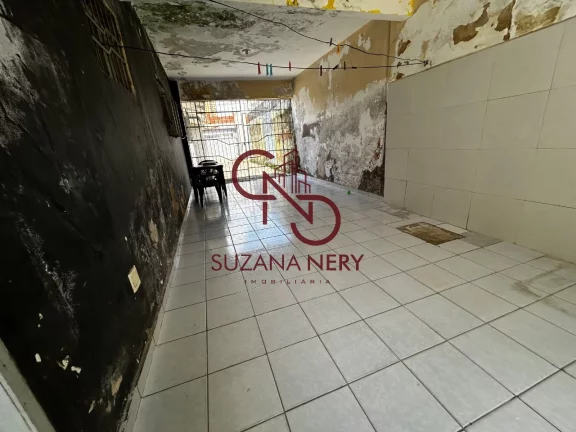 Imagem Prédio comercial com uma casa, 2 lojas e 11 kitinets