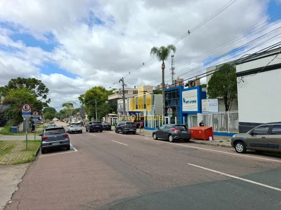 Imagem Imóvel comercial à venda em localização estratégica no Bacacheri, em terreno de esquina com gra...