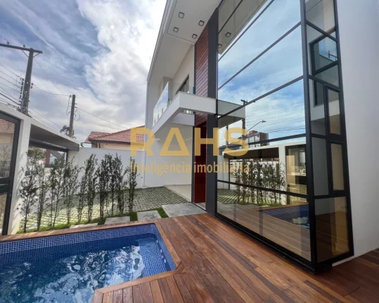 Imagem Casa com arquitetura moderna no Bairro América. Área construída de 204m² Possui 3 suítes amplas...