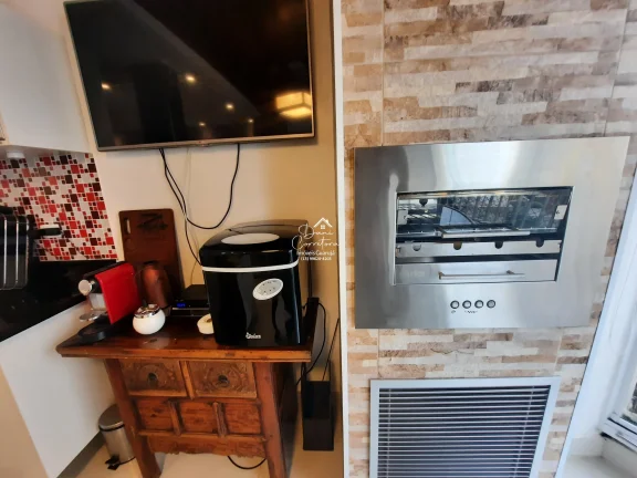 Imagem Excelente oportunidade: Apartamento atualizado com vista no Guarujá-SP, bairro Pitangueiras, 1 quarto, 2 salas, 1 banheiro, 2 vagas de garagem, 65m².