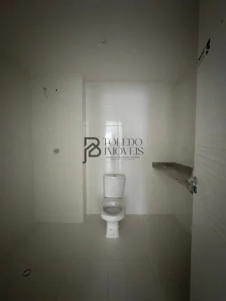 Imagem Apartamento de 2 dormitórios sendo 1 suíte, prédio frente mar no bairro Vila Mirim - Praia Grande