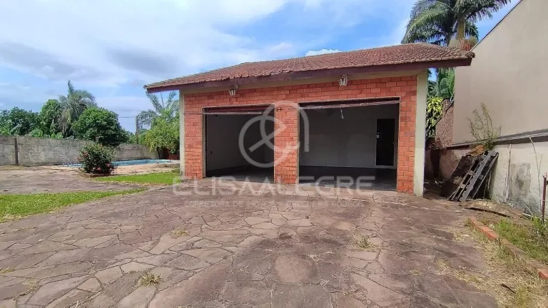 Imagem Sobrado + casa auxiliar em terreno de 1.864m² em Esteio