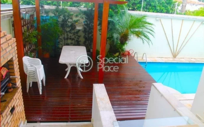 Imagem Casa de condomínio de alto padrão com 4 Suites com armários, escritório, Varanda, Living 2 ambie...
