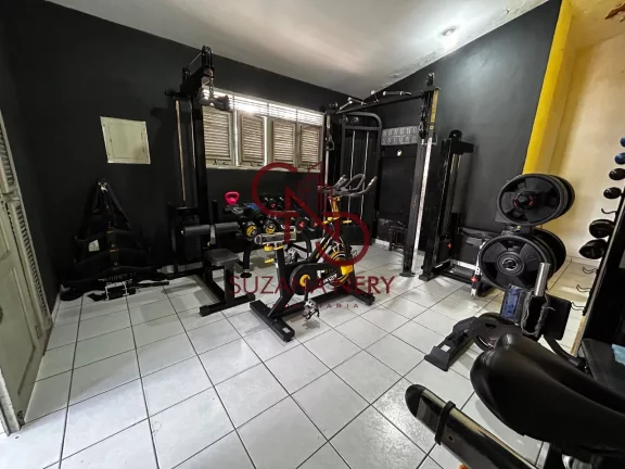 Imagem Prédio comercial com uma casa, 2 lojas e 11 kitinets