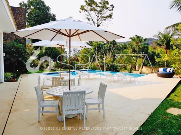 Imagem Oásis de Luxo: Casa térrea com piscina, sauna e píer privativo à venda no condomínio Marina Guarujá
