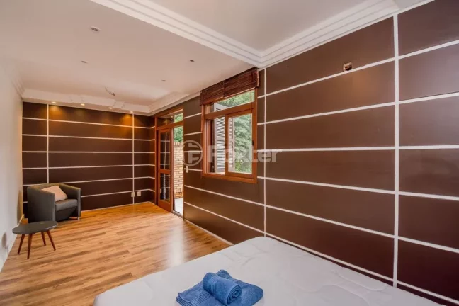 Imagem Casa em Condomínio 3 dorms à venda Avenida Vicente Monteggia, Cavalhada - Porto Alegre