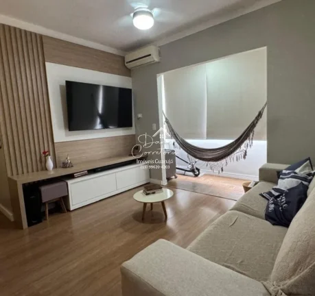 Imagem Aluguel de apartamento no Jardim Astúrias, Guarujá-SP: 2 quartos, 1 suíte, 2 salas, 2 banheiros, 1 vaga de garagem, 85m² de área.