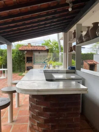 Imagem Vendo Casa de Alto Padrão com 400 m², 4 quartos s/ 2 suítes, escritório, piscina, jardim e 4 vagas