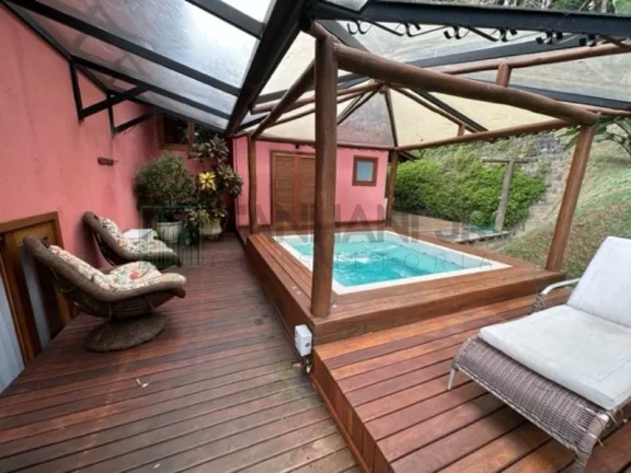 Imagem Deslumbre-se com esta incrível oportunidade de adquirir uma casa dos sonhos no exclusivo condomínio Yacamim, localizado em Ilhabela. Com uma vista esp