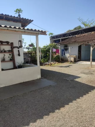 Imagem Terreno com uma casa mista no paranaguamirim