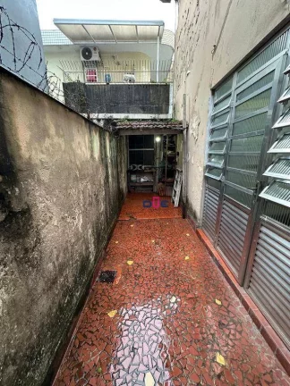 Imagem Sobrado com 2 dormitórios à venda, 98 m² por R$ 393.000 - Macuco - Santos/SP