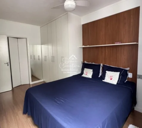 Imagem Aluguel de apartamento no Jardim Astúrias, Guarujá-SP: 2 quartos, 1 suíte, 2 salas, 2 banheiros, 1 vaga de garagem, 85m² de área.