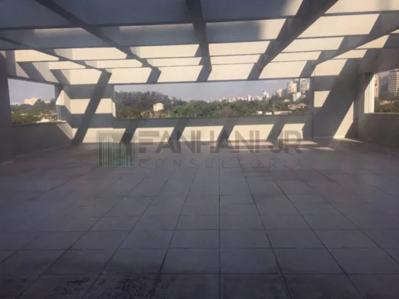 Imagem Venha se encantar com este imóvel de alto padrão, perfeito para sua empresa! Com uma fachada revestida em vidro sobre estrutura metálica, este prédio