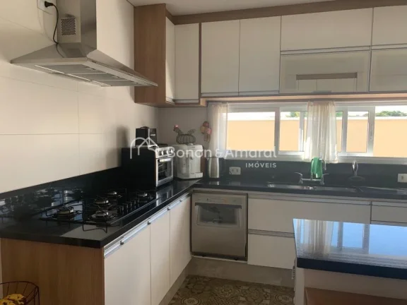 Imagem Casa térrea com sala de estar, sala de tv, lavabo, sala de jantar integrada à cozinha planejada e ...