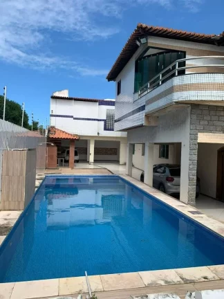 Imagem Casa de Alto Padrão na Atalaia - 4 Quartos, Piscina e Espaço de Churrasqueira - Imperdível!