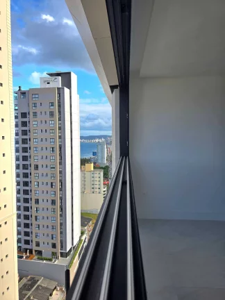 Imagem Apartamento vista mar com 3 suítes e 3 vagas de garagem no Centro de Itapema