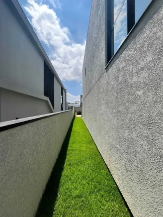 Imagem Casa de alto padrão com 4 dormitórios sendo 3 suítes e 4 vagas de garagem em Camboriú/SC