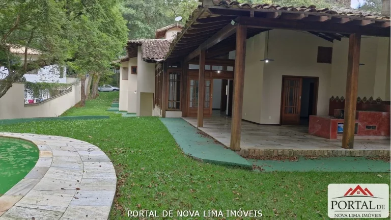 Imagem Casa a venda no condomínio Ipê da Serra, casa com armário e área de lazer com piscina. Venha conhecer no Portal de Nova Lima Imóveis - 31.98511-8000